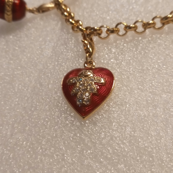 Faberge egg charm bracelet on a gold tone rolo chain. - Picture 13 of 16